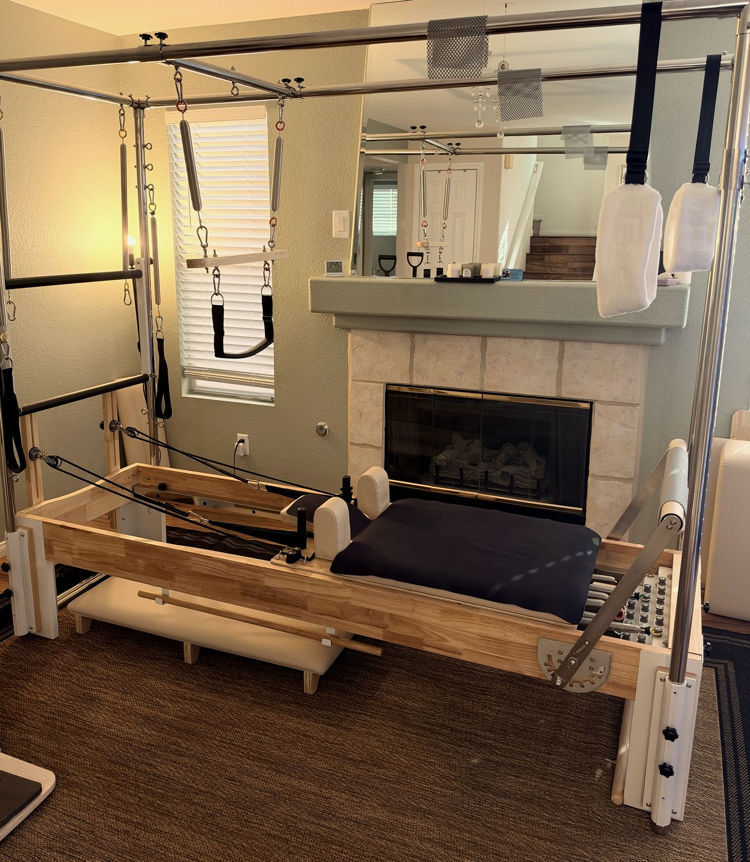 Eve's private studio in Summerlin, with the Cadillac and Reformer in warm light